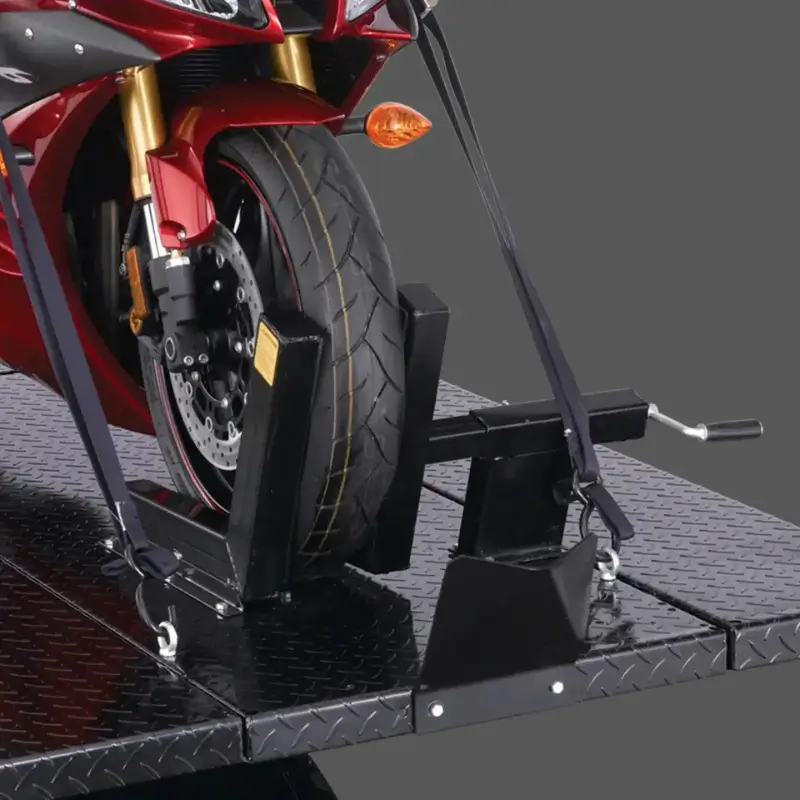Forward Lift® 1000MCLDT | Portable Motorcycle / ATV Lift Front view of a motorcycle secured on the Forward Lift 1000MCL portable motorcycle and ATV lift, showcasing the wheel chock and tie-down straps for stability.